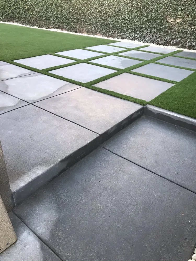 Concrete pavers and turf installed by Islander Concrete